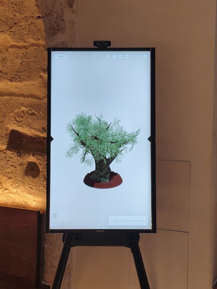 The Guestbook olive-tree installation on a portrait touchscreen at Dar Al Consul